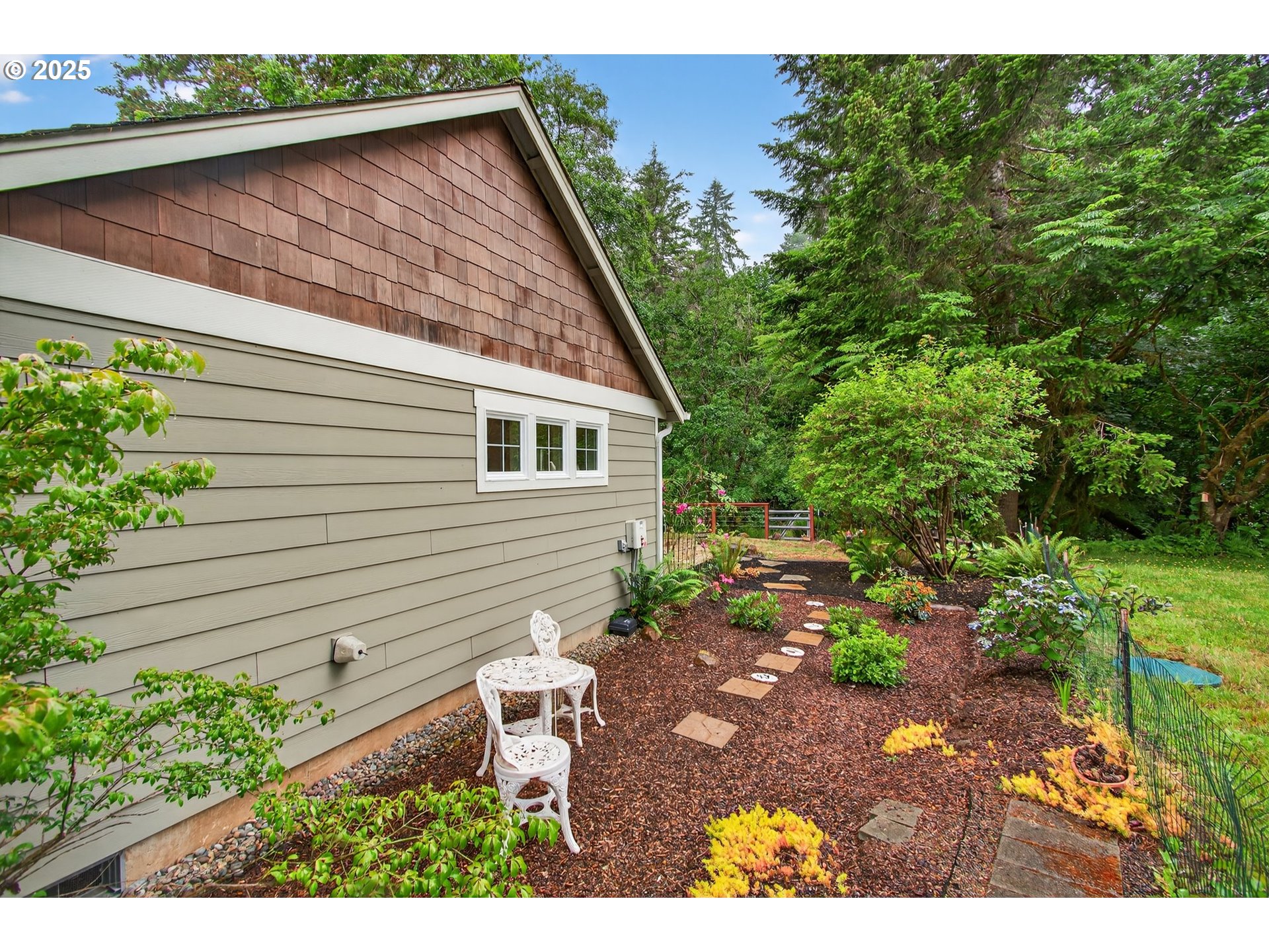721 Abernathy Creek Road Longview, WA 98632 - Photo 33 of 40 a backyard of a house with lots of green space