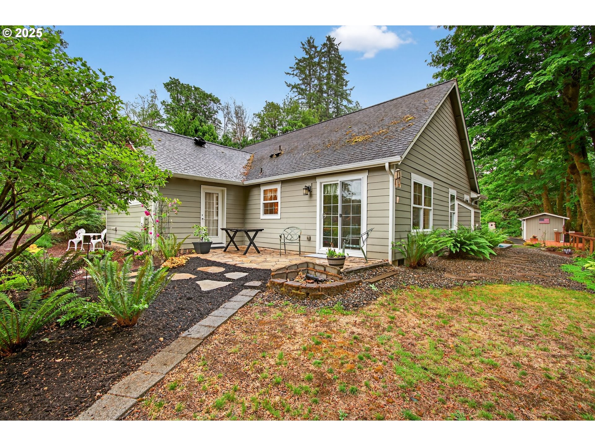 721 Abernathy Creek Road Longview, WA 98632 - Photo 34 of 40 a view of a house with backyard and sitting area