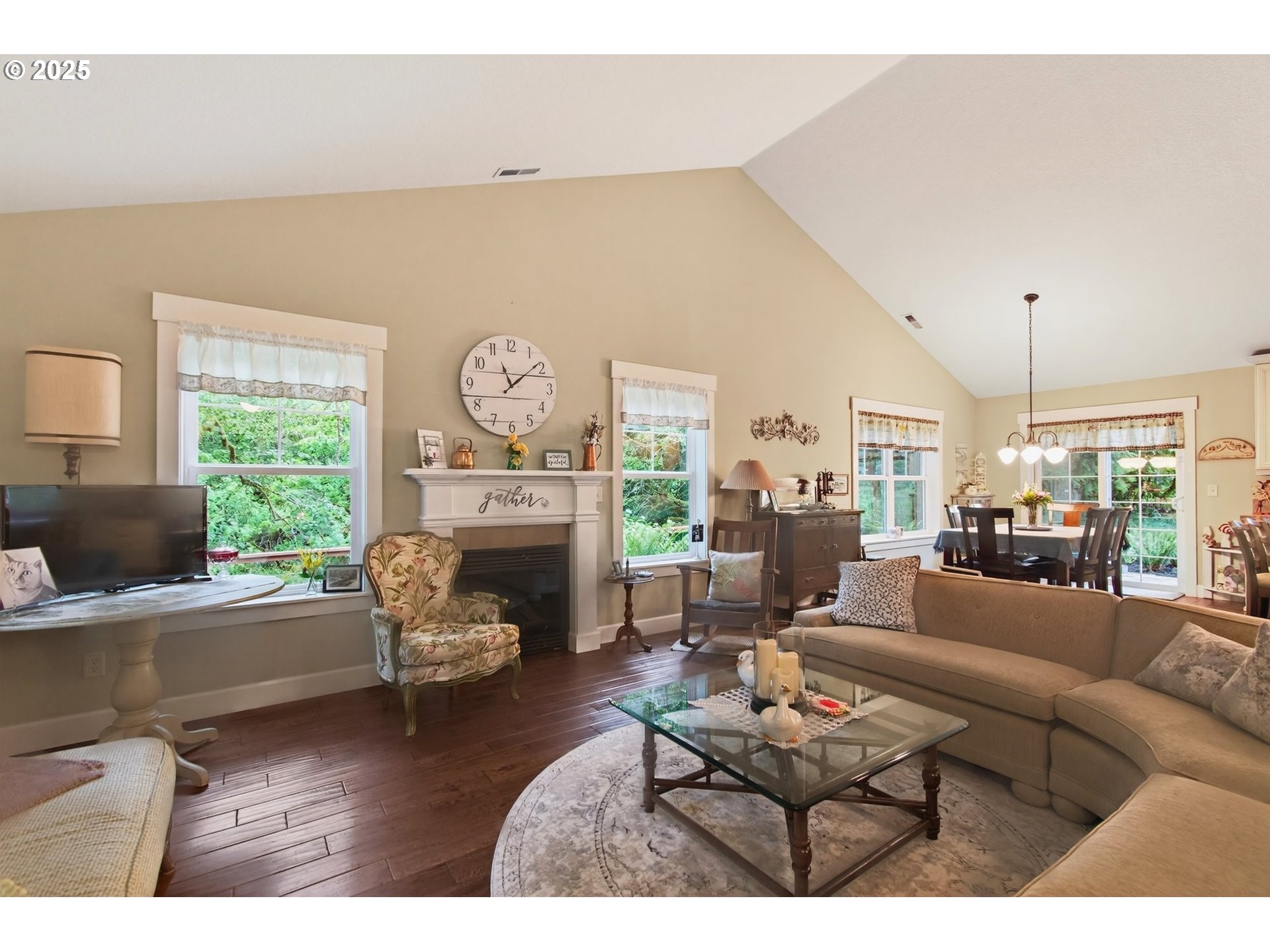 721 Abernathy Creek Road Longview, WA 98632 - Photo 8 of 40 a living room with furniture a fireplace and a large window