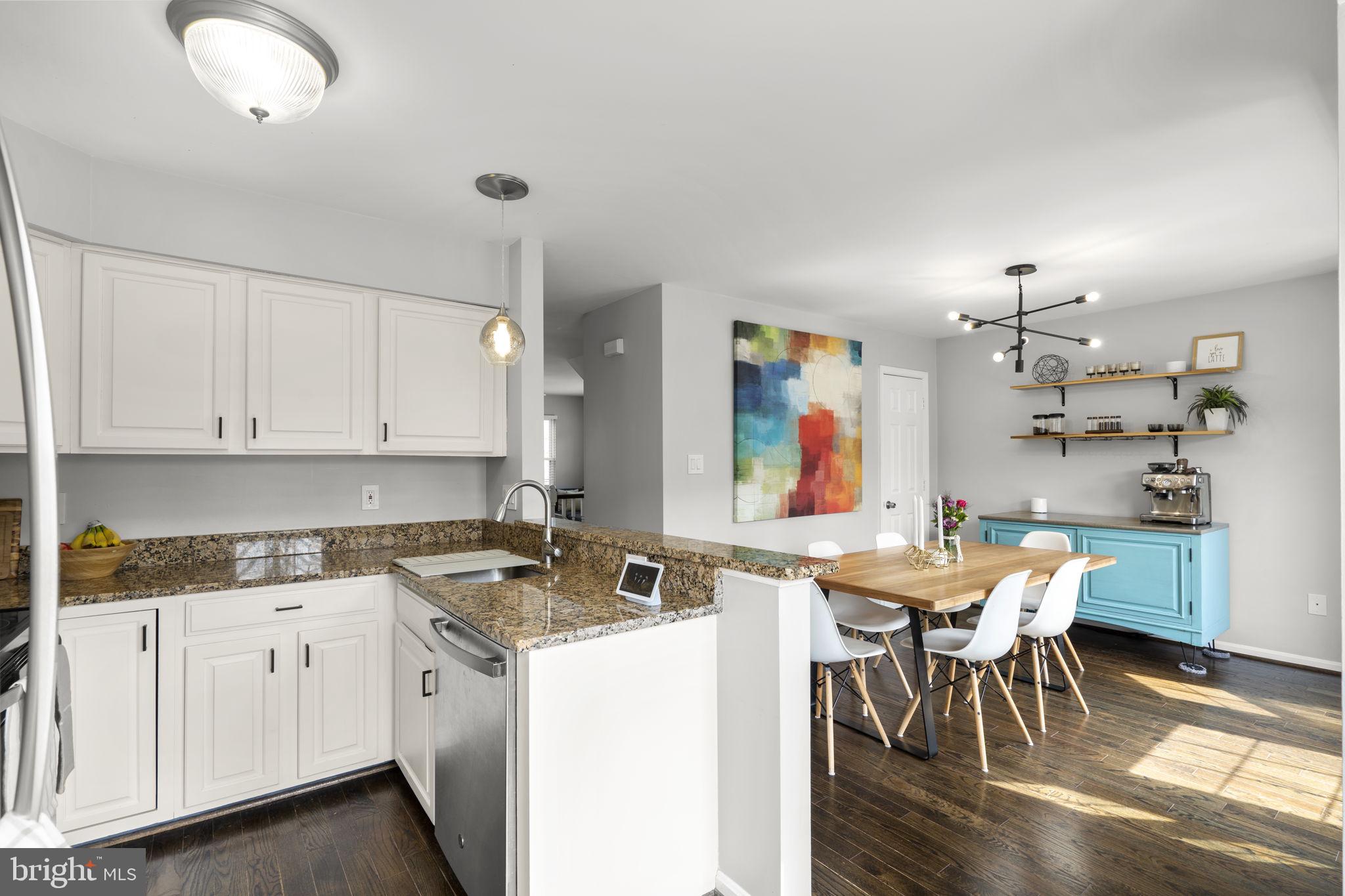 20250 Brookview Square Ashburn, VA 20147 - Photo 19 of 45 a view of kitchen with cabinets table and chairs