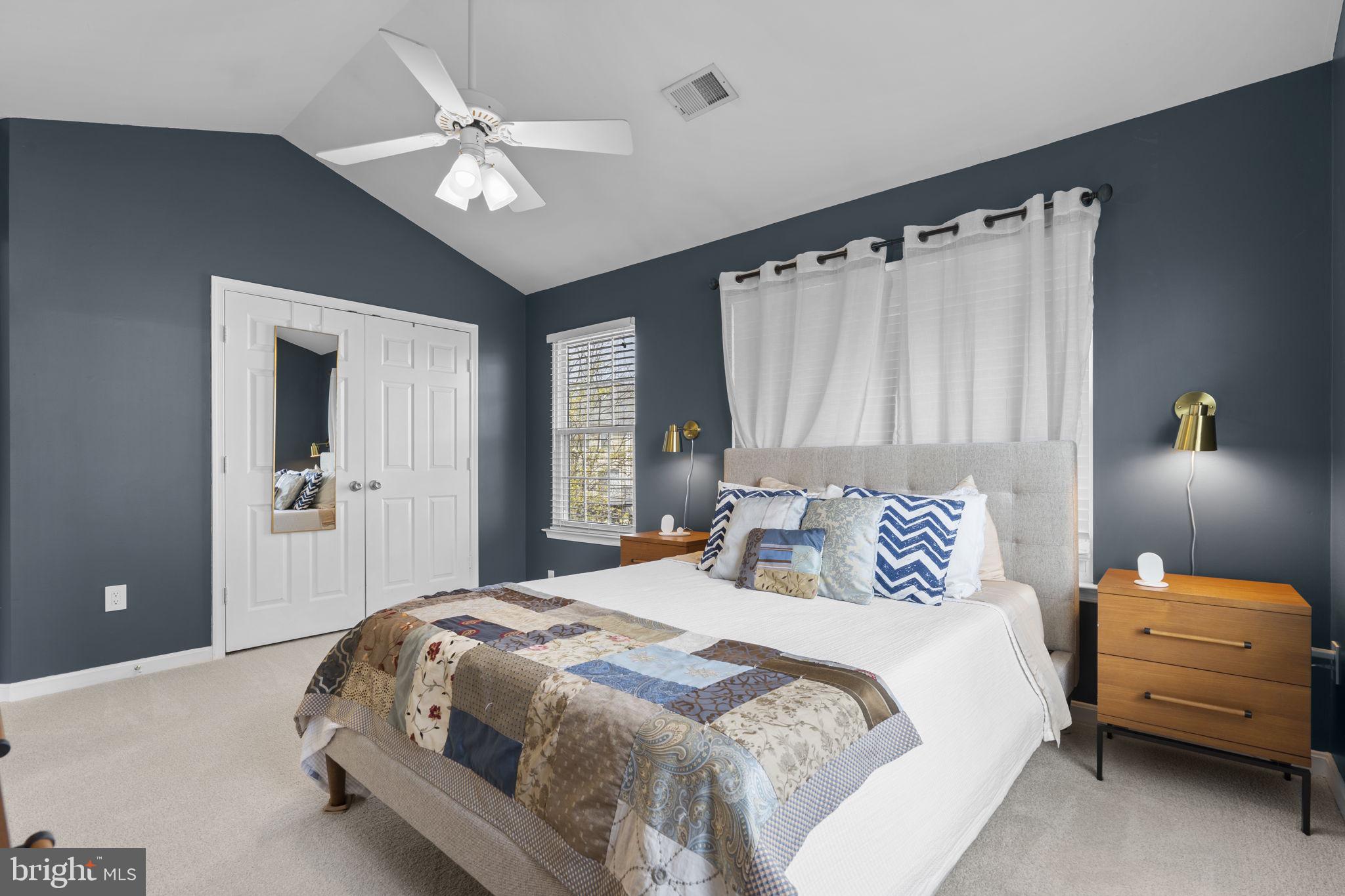 20250 Brookview Square Ashburn, VA 20147 - Photo 25 of 45 a bedroom with a bed and a chandelier