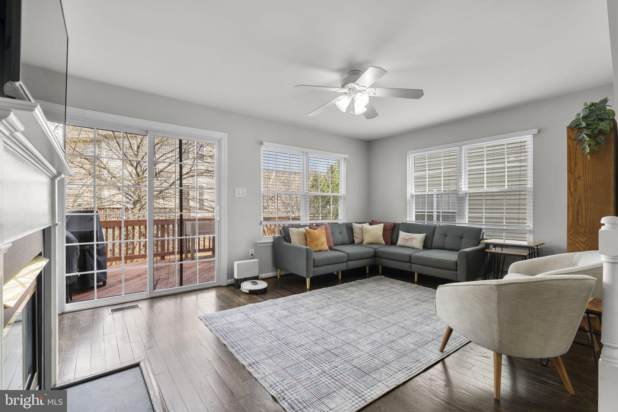 20250 Brookview Square Ashburn, VA 20147 - Photo 3 of 45 a living room with furniture and a large window
