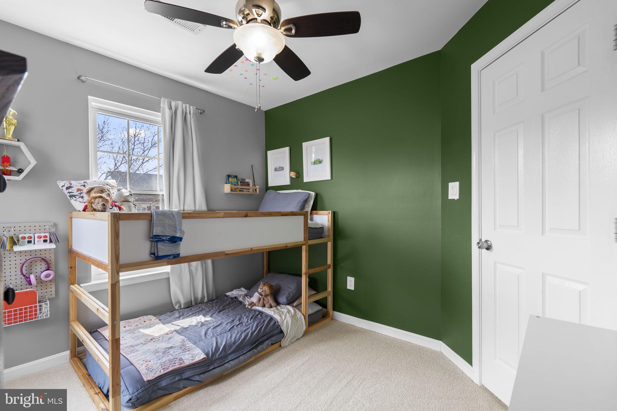 20250 Brookview Square Ashburn, VA 20147 - Photo 33 of 45 a bedroom with a bed and wooden floor