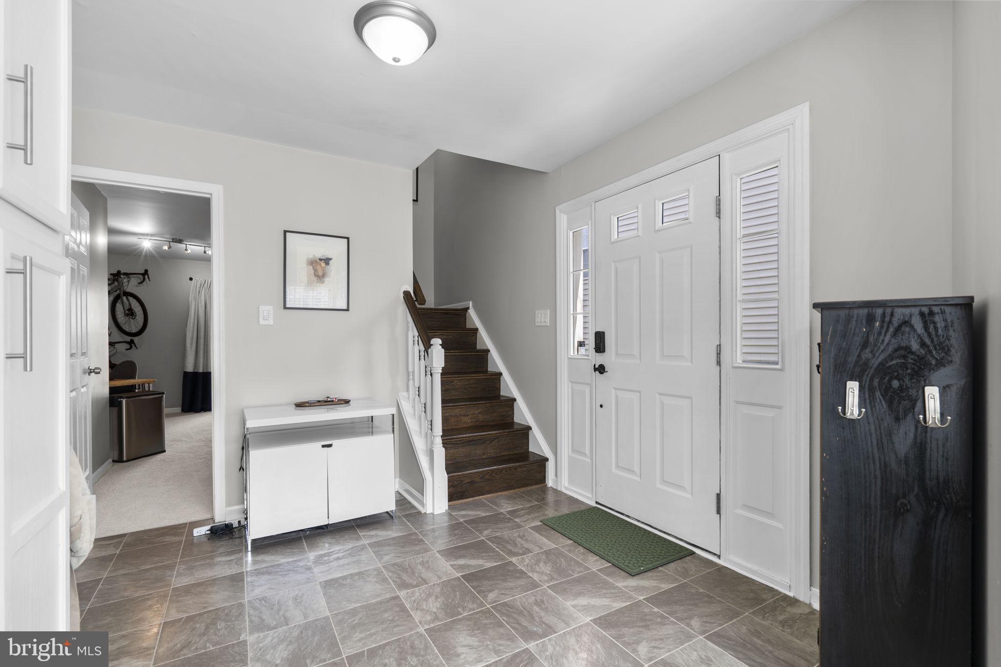 20250 Brookview Square Ashburn, VA 20147 - Photo 37 of 45 a view of a hallway with entryway and stairs