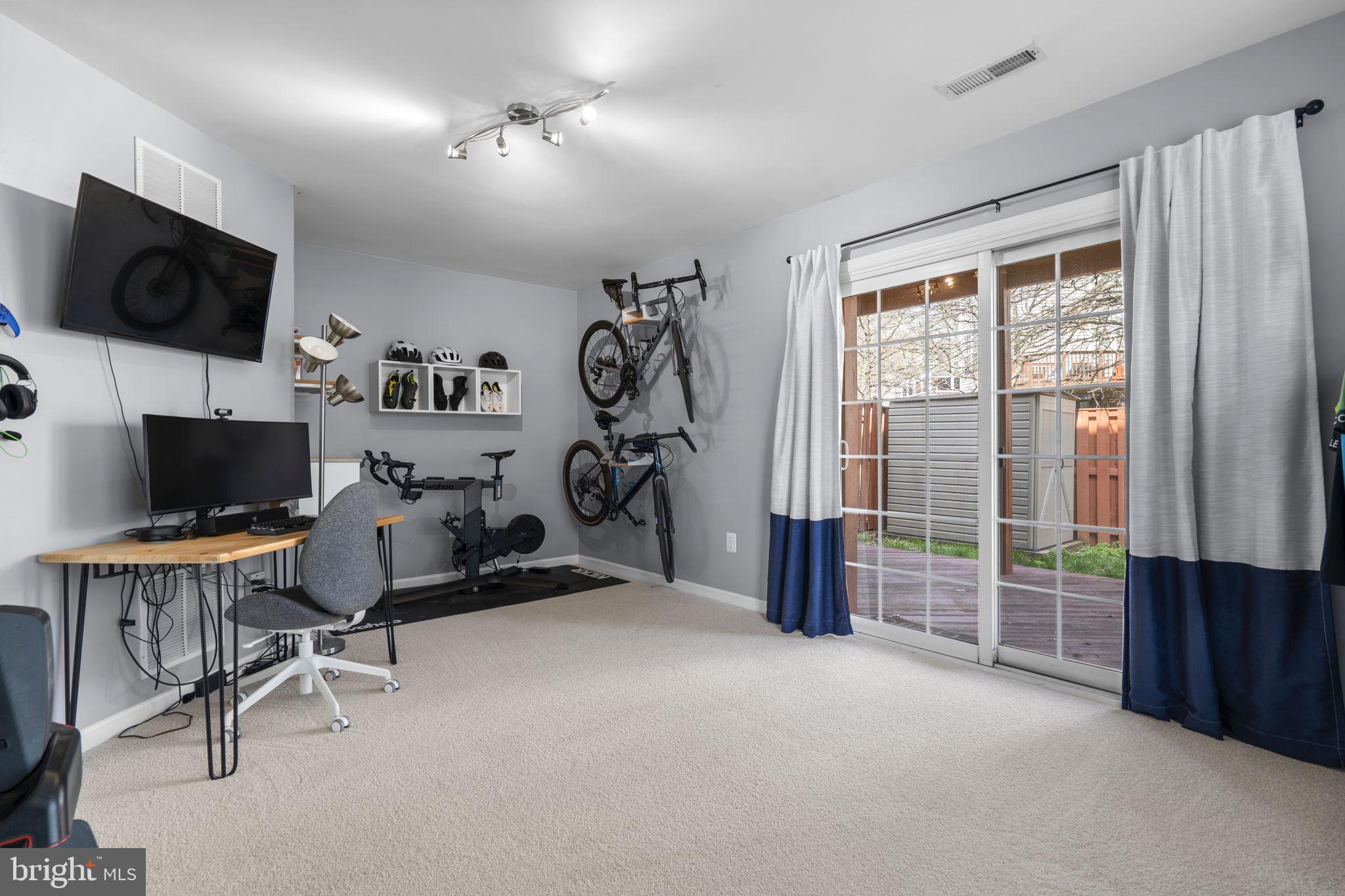 20250 Brookview Square Ashburn, VA 20147 - Photo 39 of 45 a view of a livingroom with workspace and a window