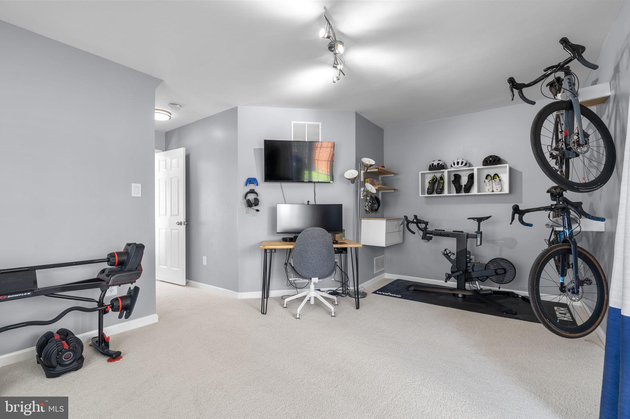 20250 Brookview Square Ashburn, VA 20147 - Photo 40 of 45 a view of a livingroom with furniture and a flat screen tv
