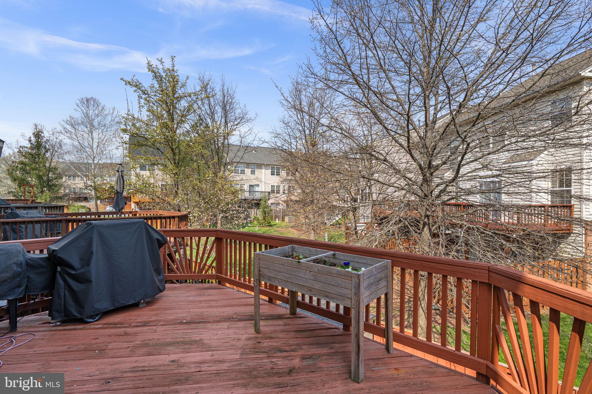 20250 Brookview Square Ashburn, VA 20147 - Photo 42 of 45 a view of balcony with wooden floor and outdoor seating