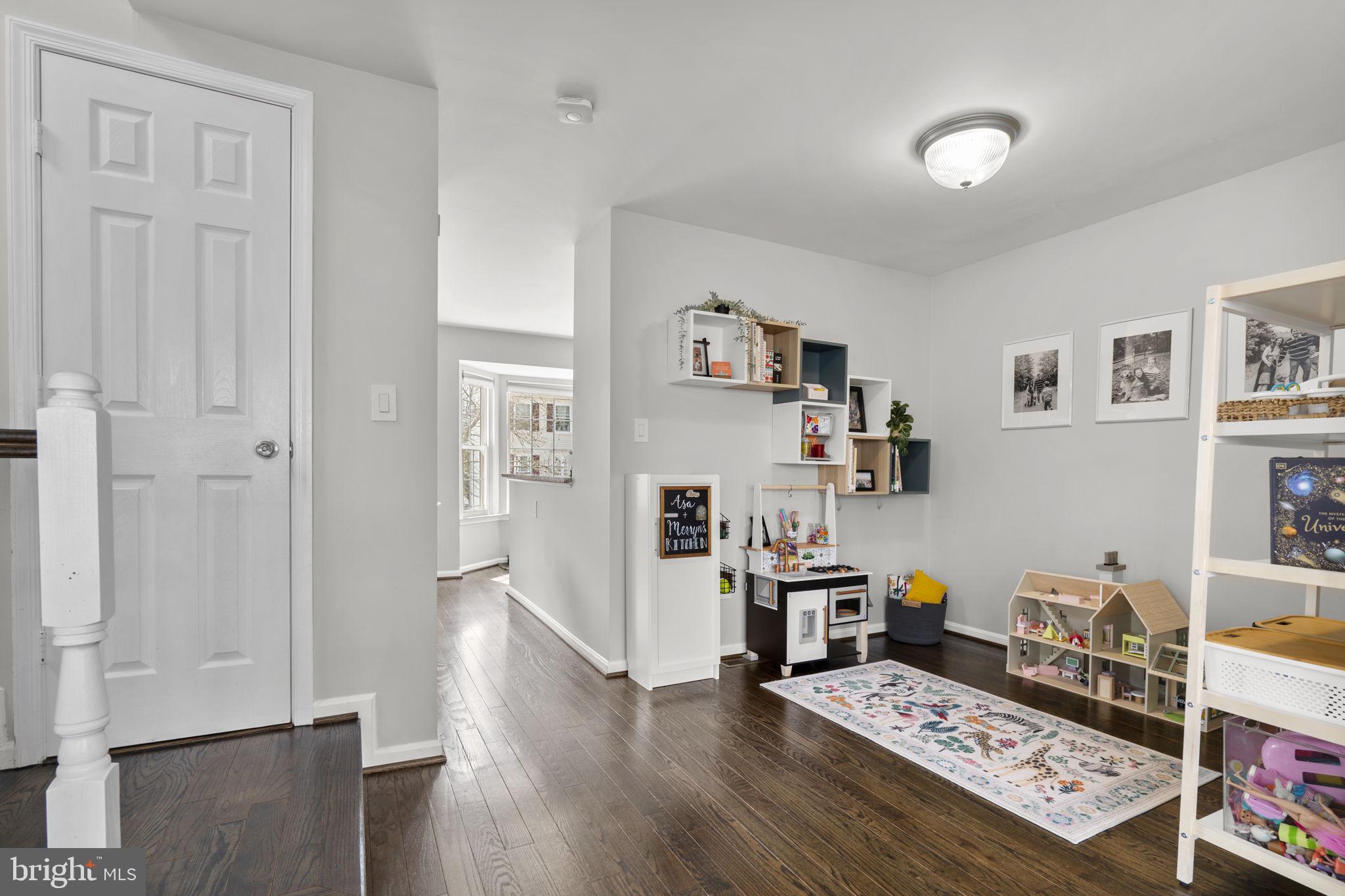 20250 Brookview Square Ashburn, VA 20147 - Photo 7 of 45 a view of a workspace with furniture and wooden floor