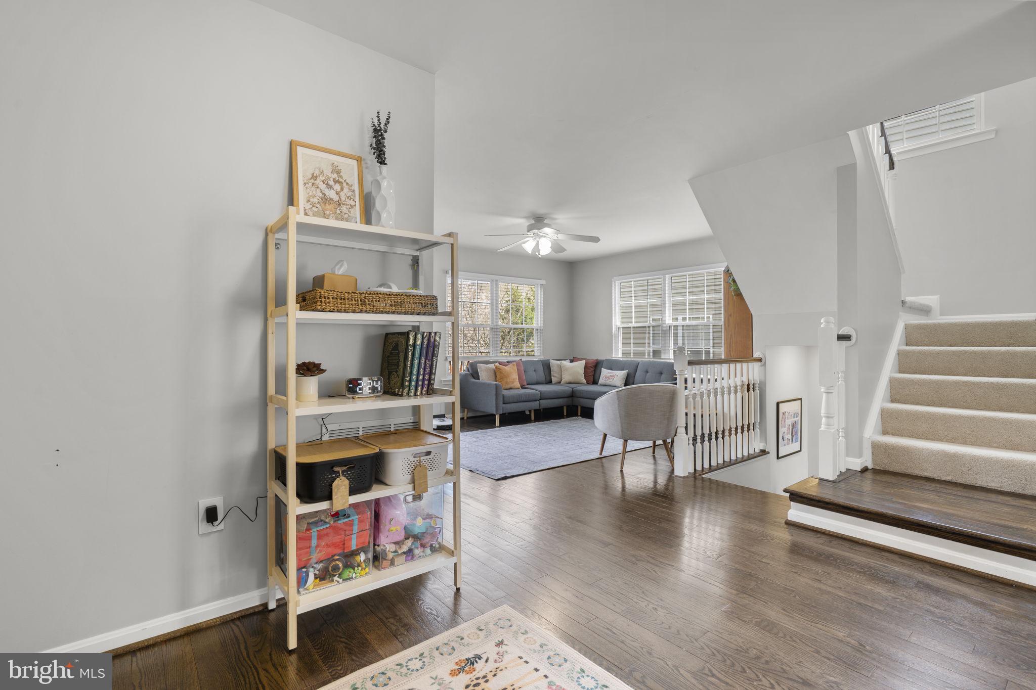 20250 Brookview Square Ashburn, VA 20147 - Photo 9 of 45 a living room with furniture and a fireplace