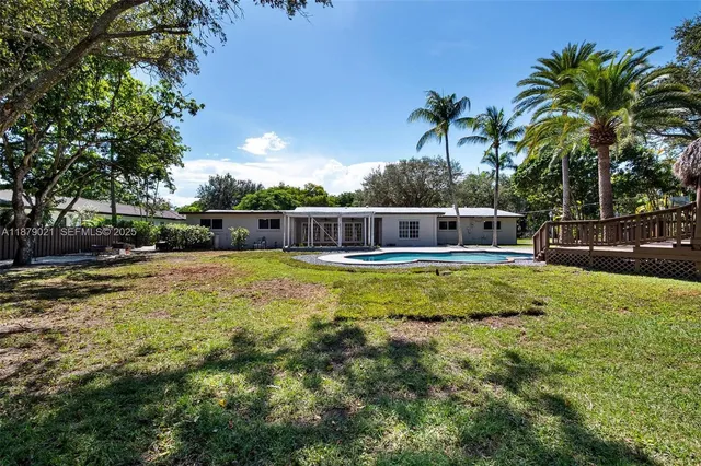 a view of a park with large trees