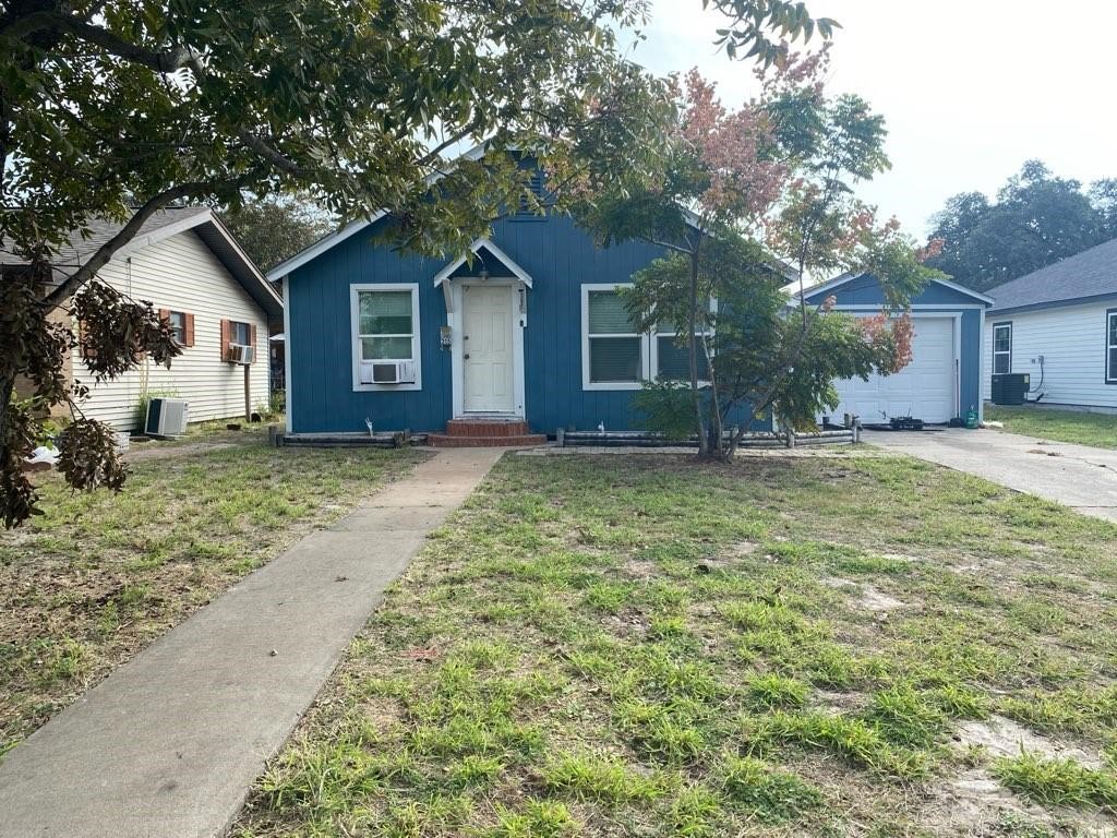 215 North Rife Street Aransas Pass, TX 78336 - Photo 1 of 11 a front view of house with yard and trees