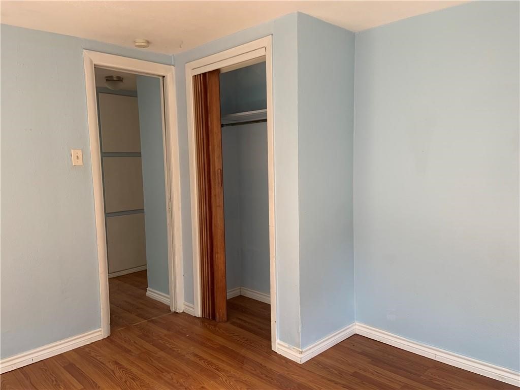 215 North Rife Street Aransas Pass, TX 78336 - Photo 9 of 11 a view of empty room with wooden floor