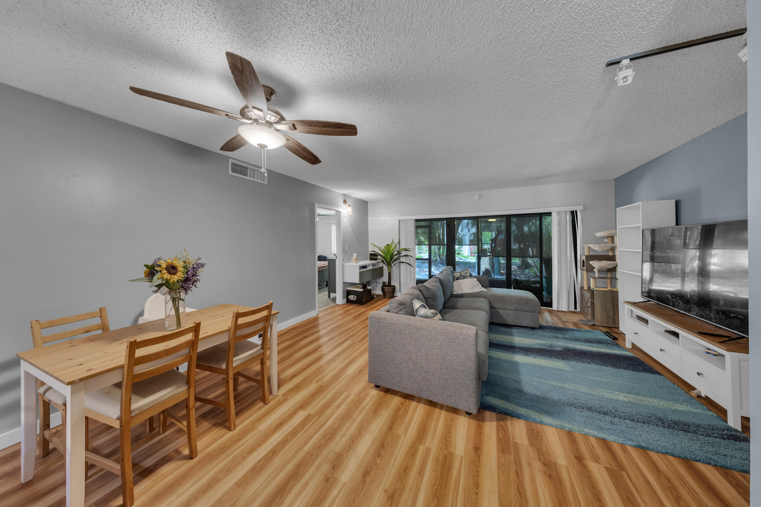 301 North Pine Island Road, Unit 101 Plantation, FL 33324 - Photo 30 of 51 a living room with furniture and a flat screen tv