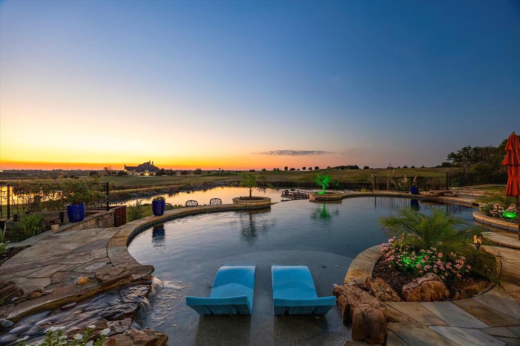 1572 Rabbit Rdg Road Heath, TX 75032 - Photo 11 of 36 a view of a lake with couches in the patio