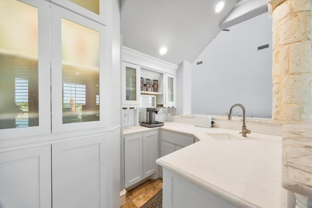 1572 Rabbit Rdg Road Heath, TX 75032 - Photo 15 of 36 a view of a sink and a refrigerator in a bathroom