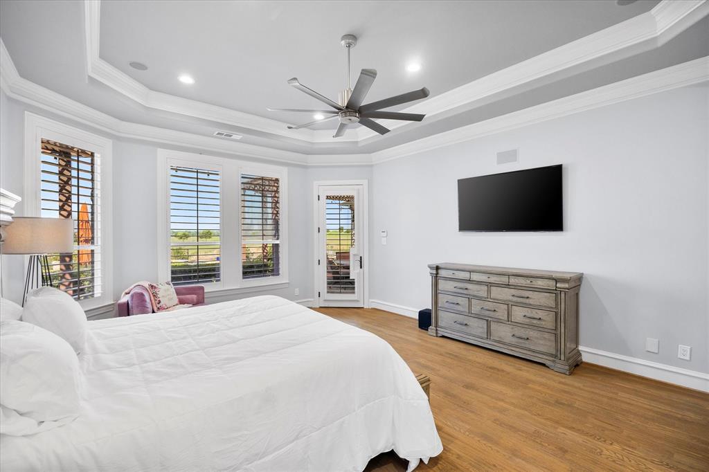 1572 Rabbit Rdg Road Heath, TX 75032 - Photo 20 of 36 a bedroom with a bed and a flat screen tv