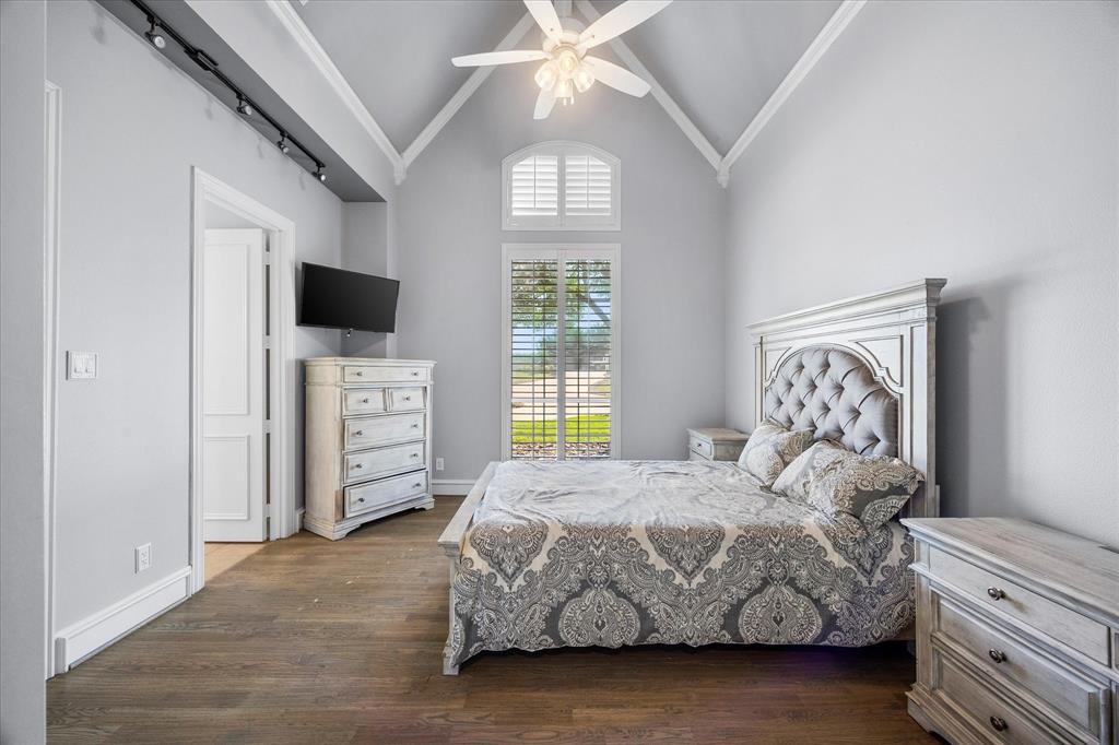 1572 Rabbit Rdg Road Heath, TX 75032 - Photo 22 of 36 a bedroom with a bed and a television