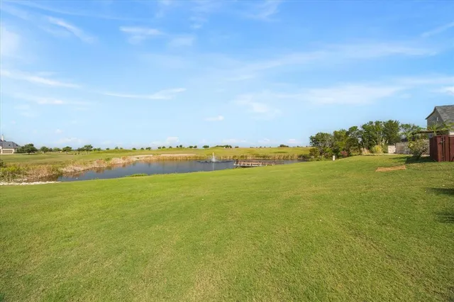 a view of a terrace with lawn chairs