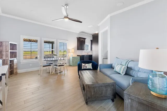 a view of a lake from a balcony with outdoor seating