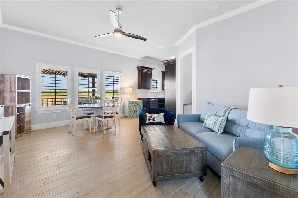 1572 Rabbit Rdg Road Heath, TX 75032 - Photo 28 of 36 a living room with furniture and wooden floor