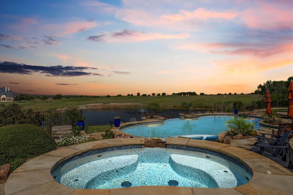 1572 Rabbit Rdg Road Heath, TX 75032 - Photo 29 of 36 a view of a lake from a balcony with outdoor seating