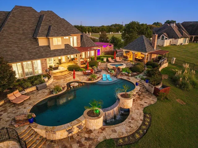 a view of a house with pool porch and furniture