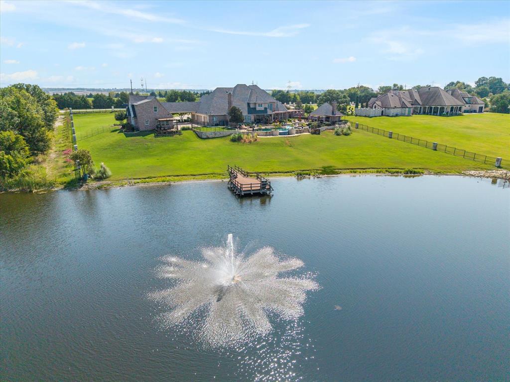 1572 Rabbit Rdg Road Heath, TX 75032 - Photo 8 of 36 a view of a lake with houses in the back