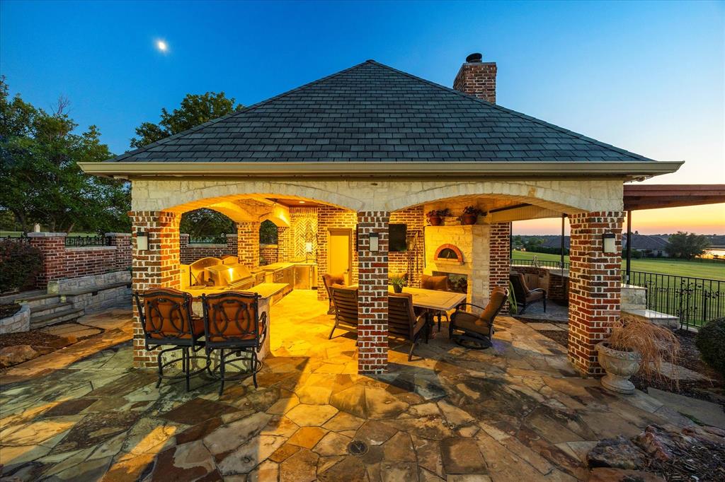 1572 Rabbit Rdg Road Heath, TX 75032 - Photo 9 of 36 a view of a chairs and table in the patio