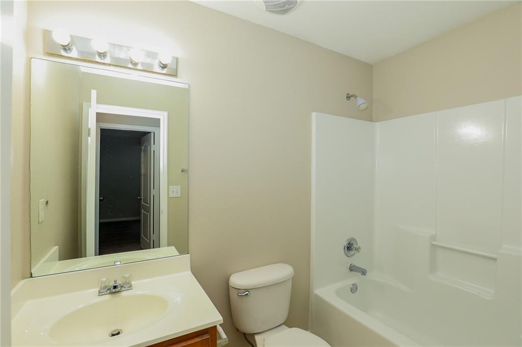 6926 Rogers Point Lithonia, GA 30058 - Photo 14 of 19 a bathroom with a sink toilet and shower