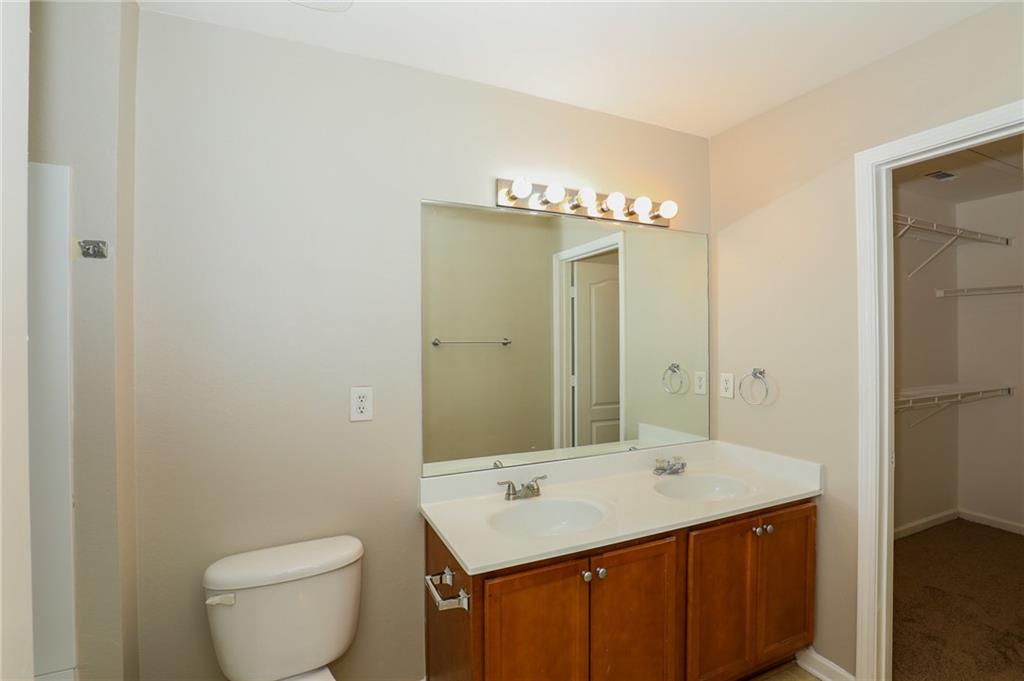 6926 Rogers Point Lithonia, GA 30058 - Photo 15 of 19 a bathroom with a sink and a mirror