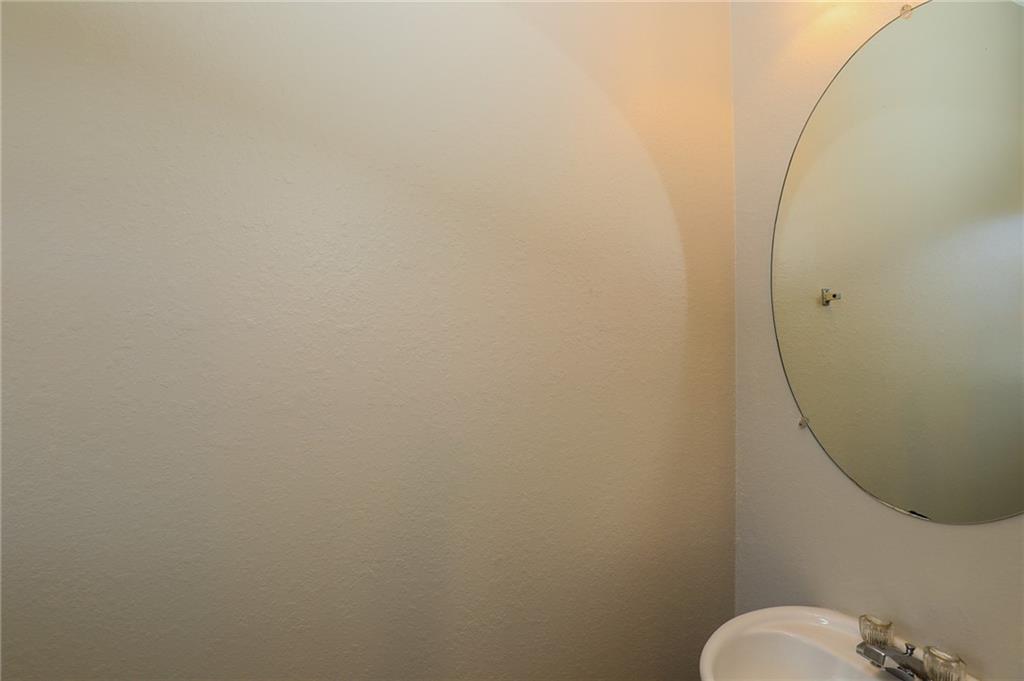 6926 Rogers Point Lithonia, GA 30058 - Photo 16 of 19 a bathroom with a sink mirror and toilet