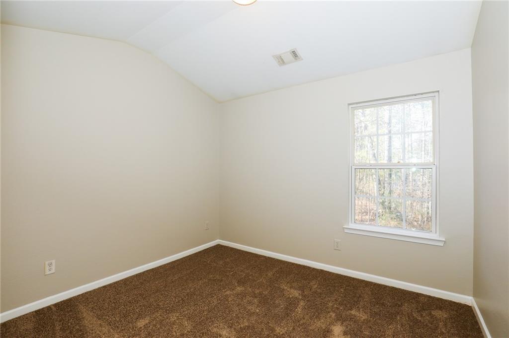 6926 Rogers Point Lithonia, GA 30058 - Photo 3 of 19 an empty room with a window