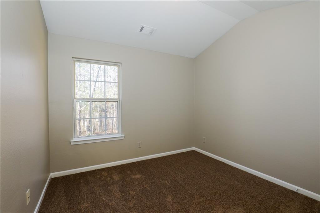 6926 Rogers Point Lithonia, GA 30058 - Photo 5 of 19 an empty room with a window
