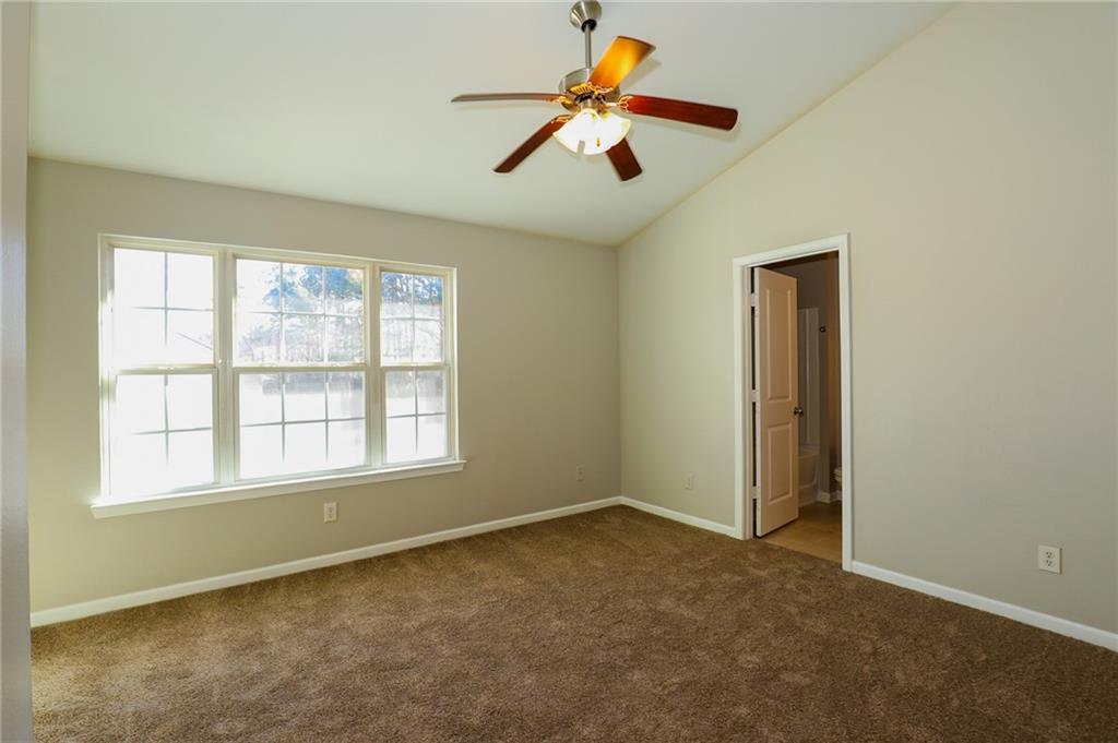 6926 Rogers Point Lithonia, GA 30058 - Photo 7 of 19 wooden floor in an empty room with a window