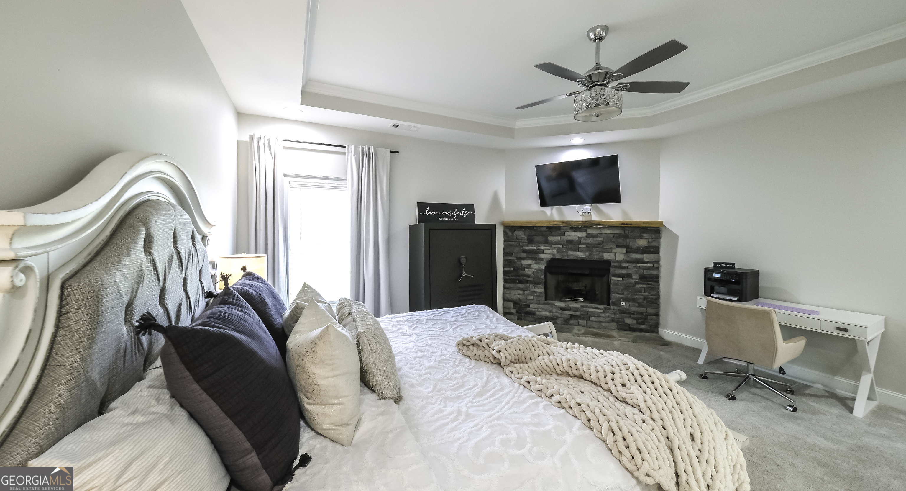 2392 Welcome Road Roopville, GA 30170 - Photo 23 of 43 a bedroom with a bed and a fireplace