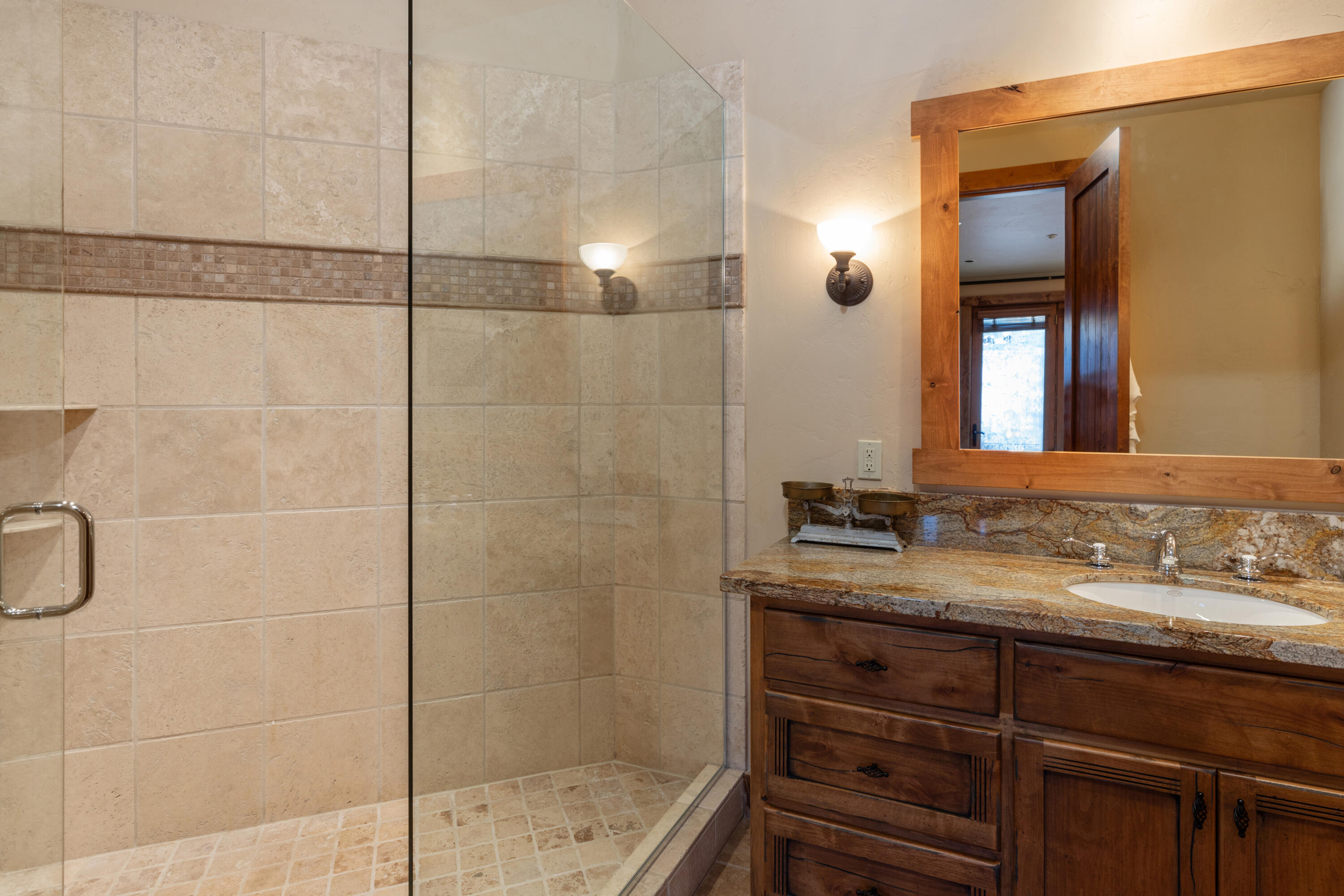 213 Josefa Lane Telluride, CO 81435 - Photo 22 of 35 a bathroom with a sink and a mirror
