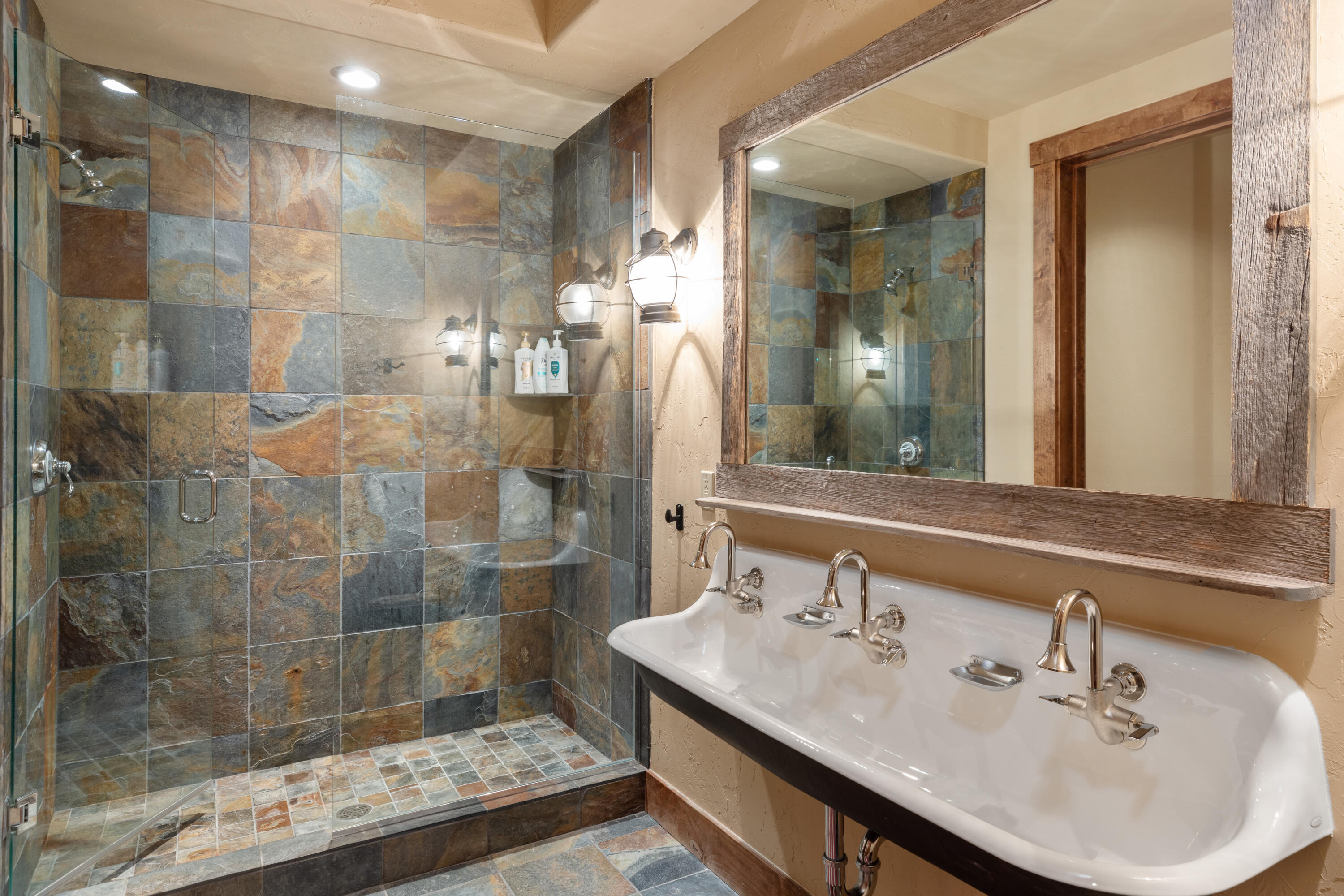 213 Josefa Lane Telluride, CO 81435 - Photo 29 of 35 a bathroom with a sink shower and a mirror
