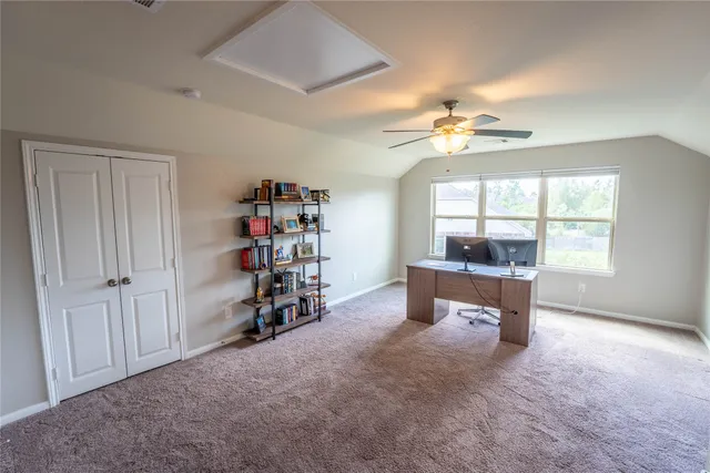an empty room with furniture and a window
