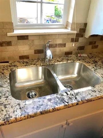 a view closed kitchen countertops and a stove