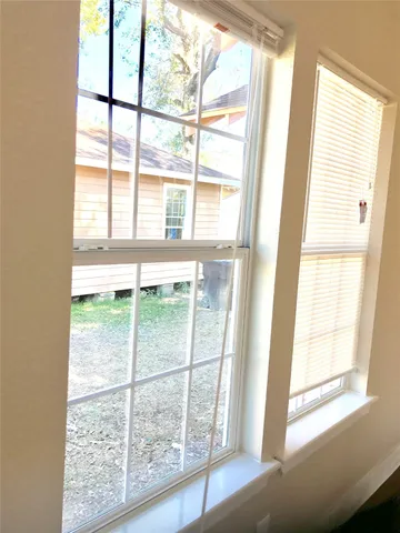 a view of a room that has a window in it