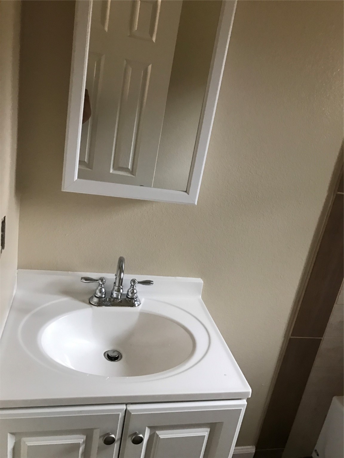 1704 Sam Wilson Street, Unit 7 Houston, TX 77020 - Photo 10 of 10 a bathroom with a sink and a mirror