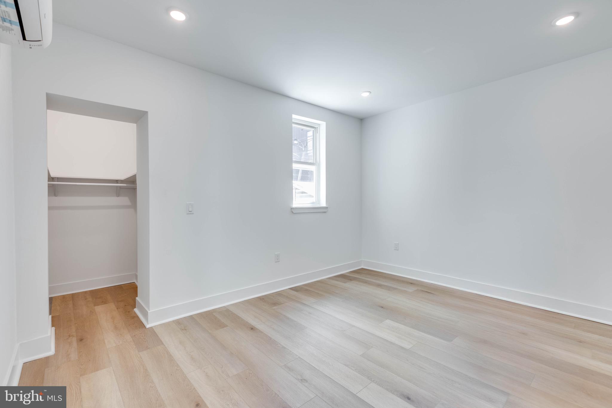 4220 Baltimore Avenue, Unit 2 Philadelphia, PA 19104 - Photo 5 of 11 an empty room with wooden floor and window