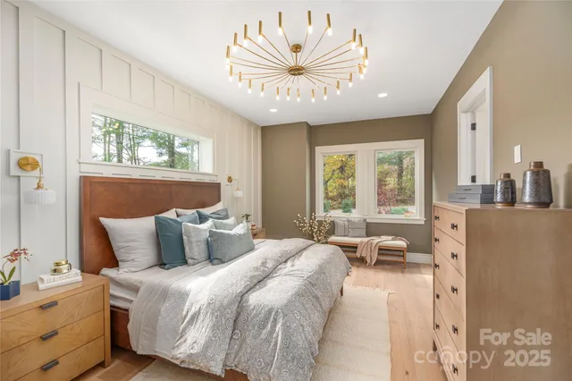 a bedroom with bed and window