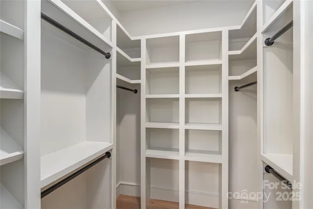 a view of an empty walk in closet