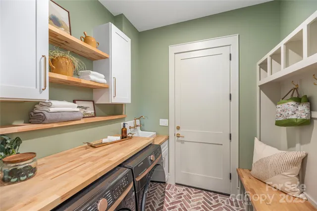 a bathroom with a sink a mirror and a shower