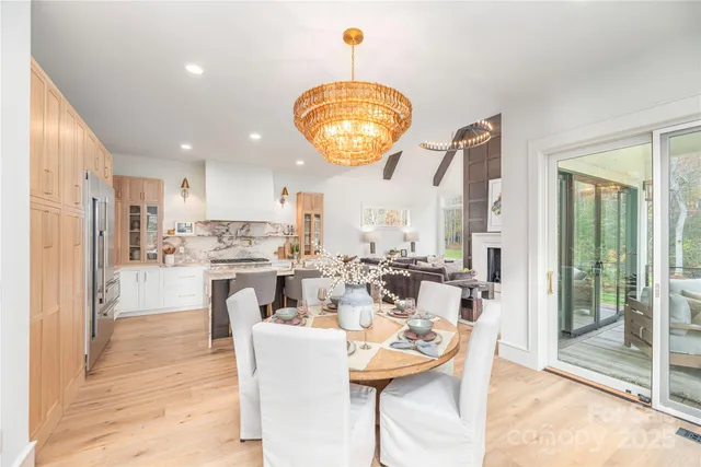 a very nice looking dining room with a table and chairs