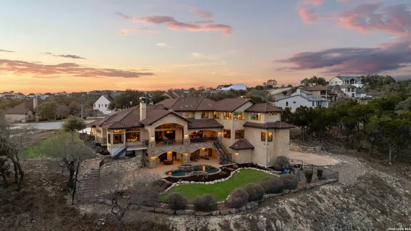 an aerial view of a house with a garden