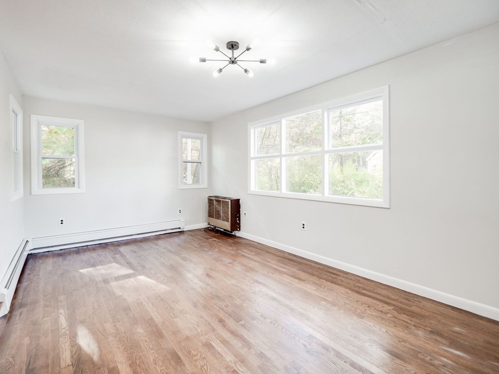 116 Arkansas Road Tewksbury, MA 01876 - Photo 11 of 38 a view of an empty room with a window