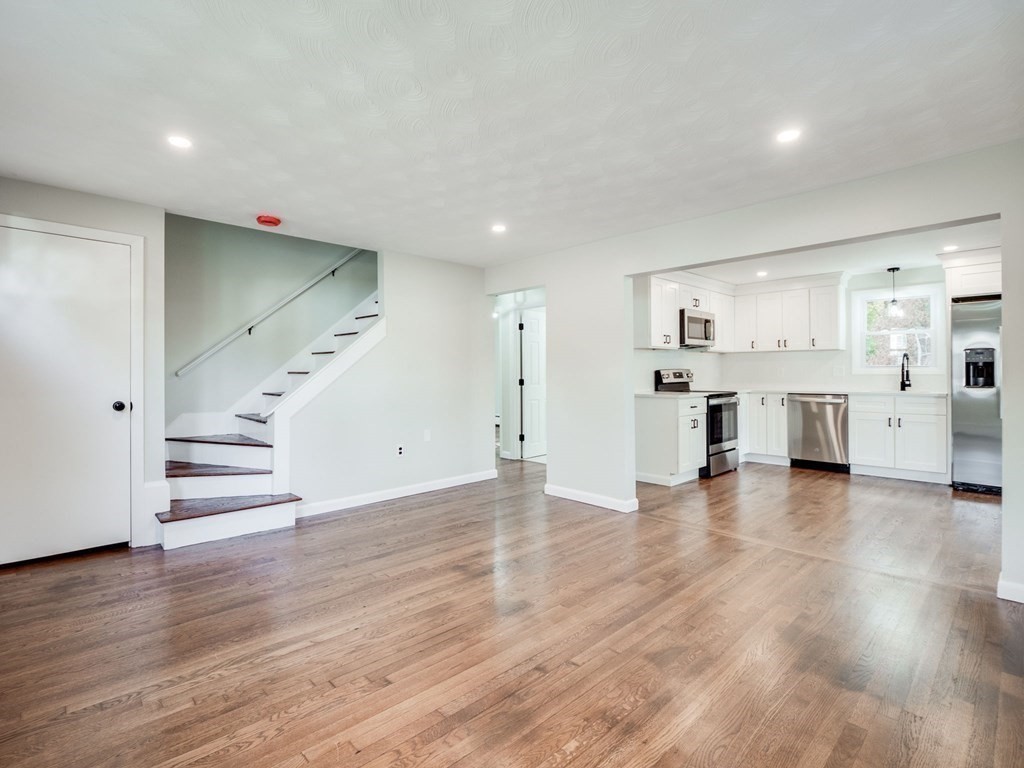 116 Arkansas Road Tewksbury, MA 01876 - Photo 12 of 38 a view of a kitchen with wooden floor and a sink
