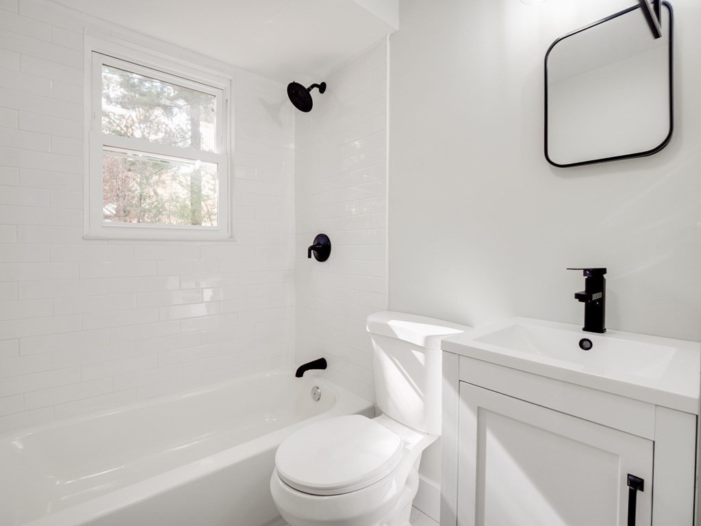 116 Arkansas Road Tewksbury, MA 01876 - Photo 17 of 38 a bathroom with a sink a toilet and a bathtub